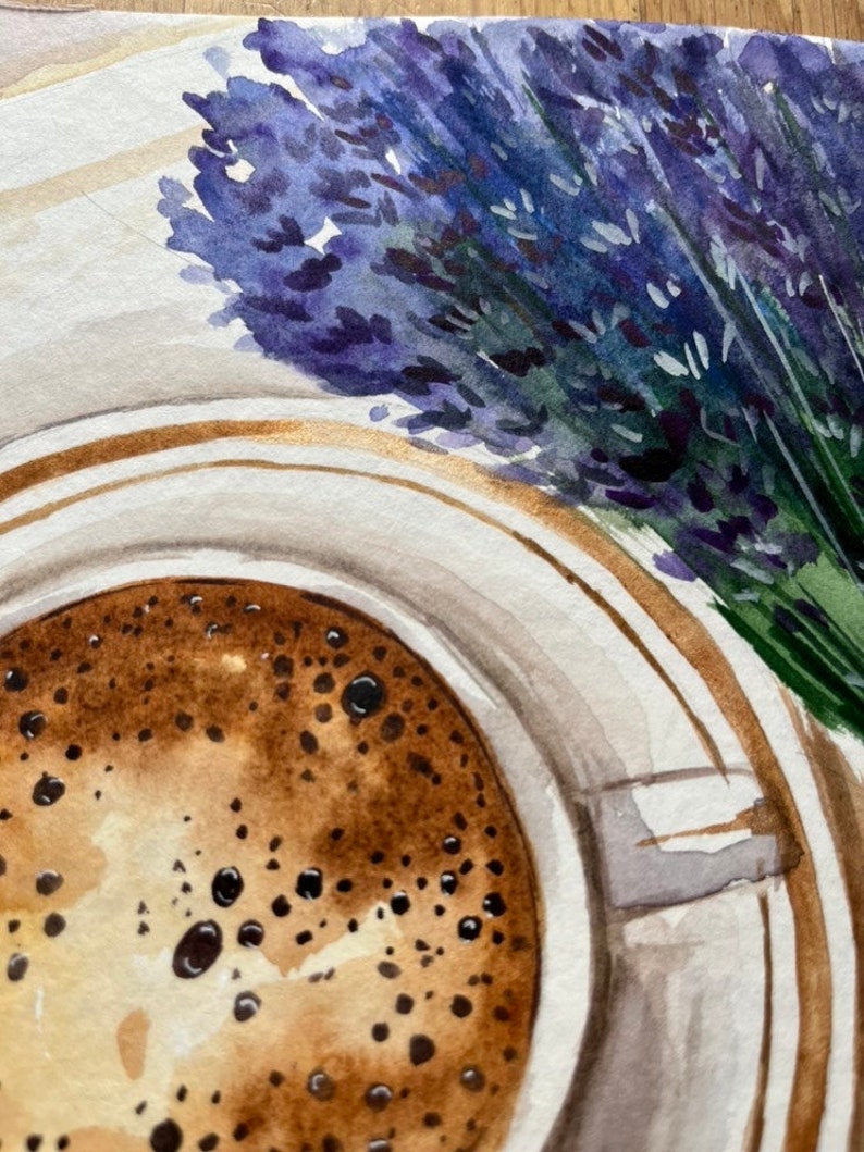 May include: A watercolor painting of a cup of coffee with a brown and white foam on top. A bouquet of lavender flowers is in the background.