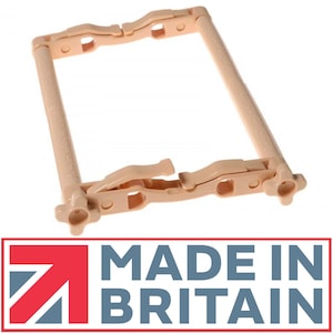 May include: A beige plastic embroidery hoop with a locking mechanism. The hoop is made in Britain.