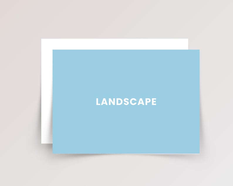 May include: A rectangular light blue card with the word LANDSCAPE printed in white capital letters in the center. The card is positioned in front of a plain white rectangular card, creating a layered effect with clean edges and a flat design.