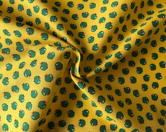 Green apples on yellow 100% lightweight cotton poplin fabric