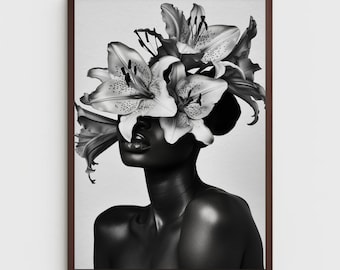 May include: Black and white photo of a person with lilies covering their face. The lilies are in focus and the person's face is obscured by the flowers.