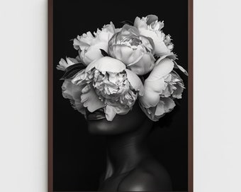 Peut inclure: Photographie en noir et blanc d'une personne avec un bouquet de pivoines blanches couvrant son visage. L'arrière-plan est noir.