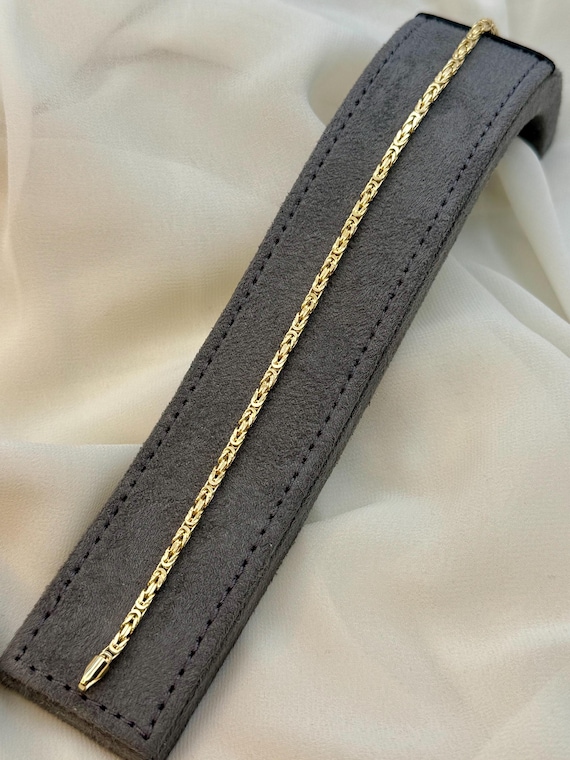 Bracciale uomo in oro giallo 18 carati modello piastrina