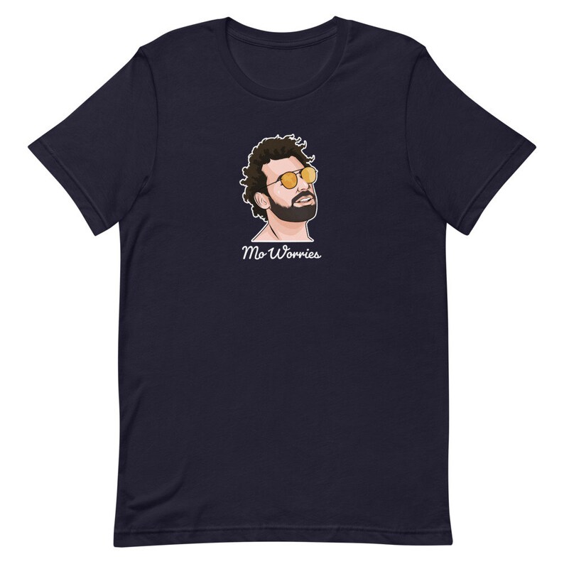 May include: A navy blue t-shirt featuring a cartoon illustration of a man wearing sunglasses and the text "Mo Worries".