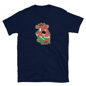 May include: Navy blue t-shirt with a graphic of a football player in a red jersey with the text "ONLY GOD CAN JUDGE ME" in a banner.