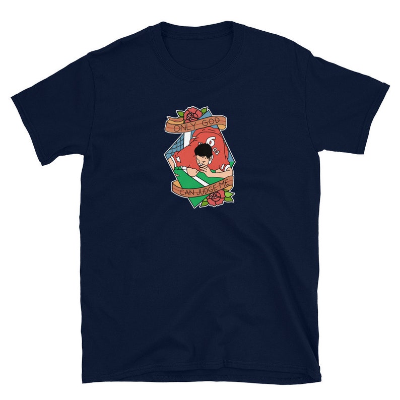May include: Navy blue t-shirt with a graphic of a football player in a red jersey with the text "ONLY GOD CAN JUDGE ME" in a banner.