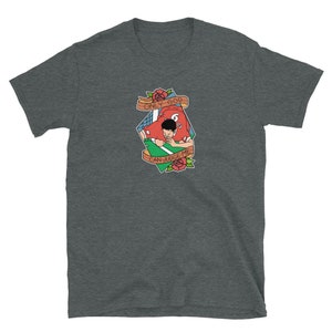 May include: A dark heather grey t-shirt with a cartoon illustration of a person in a red jersey with the text "ONLY GOD CAN JUDGE ME" in a banner above them.