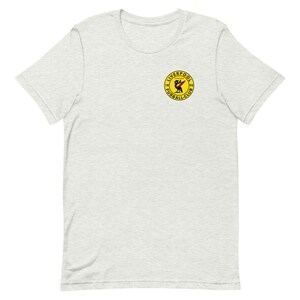 May include: A heather grey t-shirt with a yellow circle logo featuring a red bird and the text "Liverpool Football Club 1892".