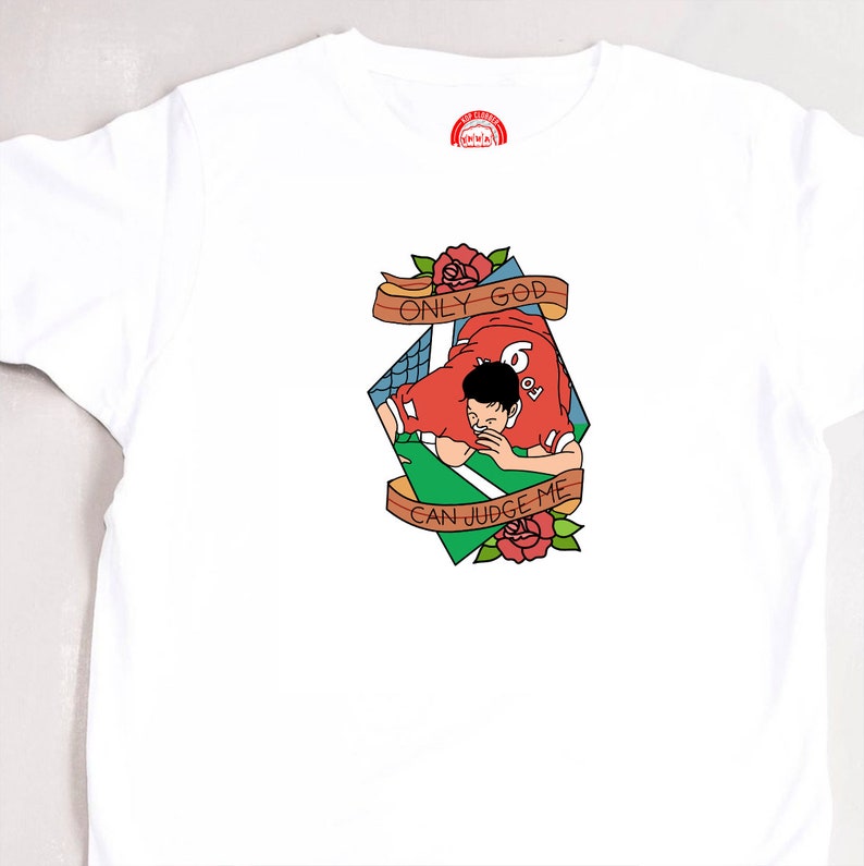 May include: A white t-shirt with a red, green, and brown illustration of a soccer player with the text "Only God Can Judge Me".