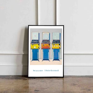 May include: A framed print of a painting by Wayne Thiebaud depicting three pinball machines with different backboards. The machines are yellow, red, and blue with white accents. The backboards are white with a square, a circle, and a grid pattern.