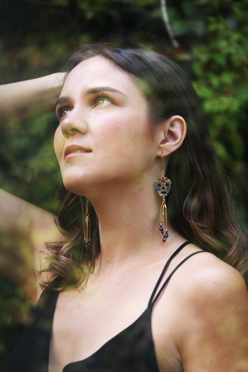Hand-beaded skull shaped earrings with 24k gold bath chain