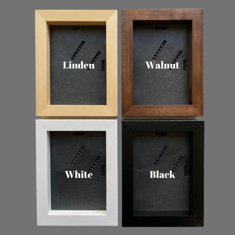 May include: Four picture frames in different colors: Linden, Walnut, White, and Black. Each frame has a black mat and a white label with the color name.