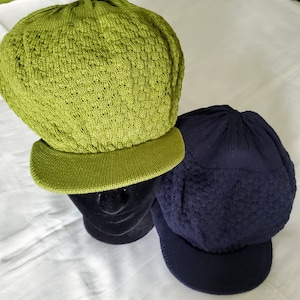 Knitted hat with a peak