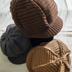 Knitted hat with a peak