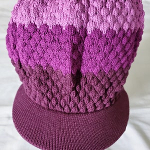 Knitted hat with a peak