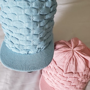 Knitted hat with a peak