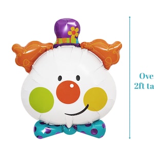 May include: A large white clown balloon with orange hair, a purple hat with a flower, a red nose, yellow and green polka dots, and a blue bow tie. The balloon is over 2 feet tall.
