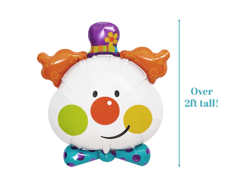 May include: A large white clown balloon with orange hair, a purple hat with a flower, a red nose, yellow and green polka dots, and a blue bow tie. The balloon is over 2 feet tall.
