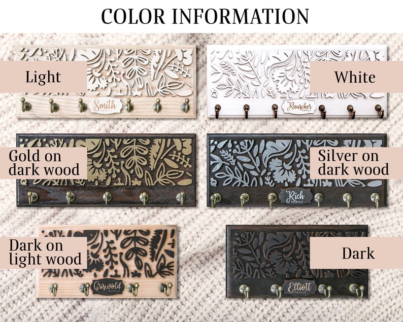 May include: Key holder with a floral design in various colours and finishes. Options include light wood, dark wood with gold accents, dark wood with silver accents, white, and dark wood with black accents. Each key holder has a personalised nameplate.