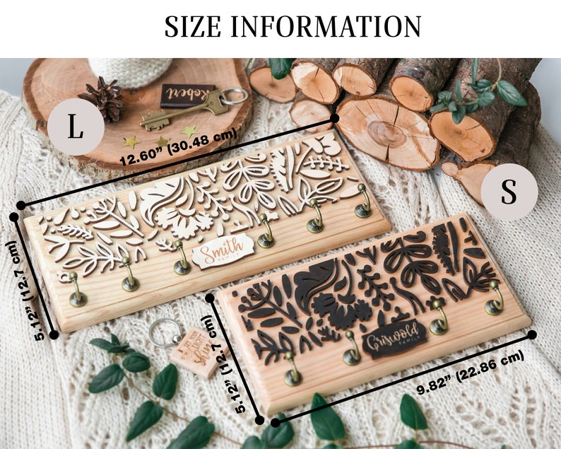 May include: Two wooden key holders with a floral design. The larger key holder is 12.60 inches by 5.12 inches and the smaller key holder is 9.82 inches by 5.12 inches. The larger key holder has the name "Smith" on it and the smaller key holder has the name "Griswold Family" on it.