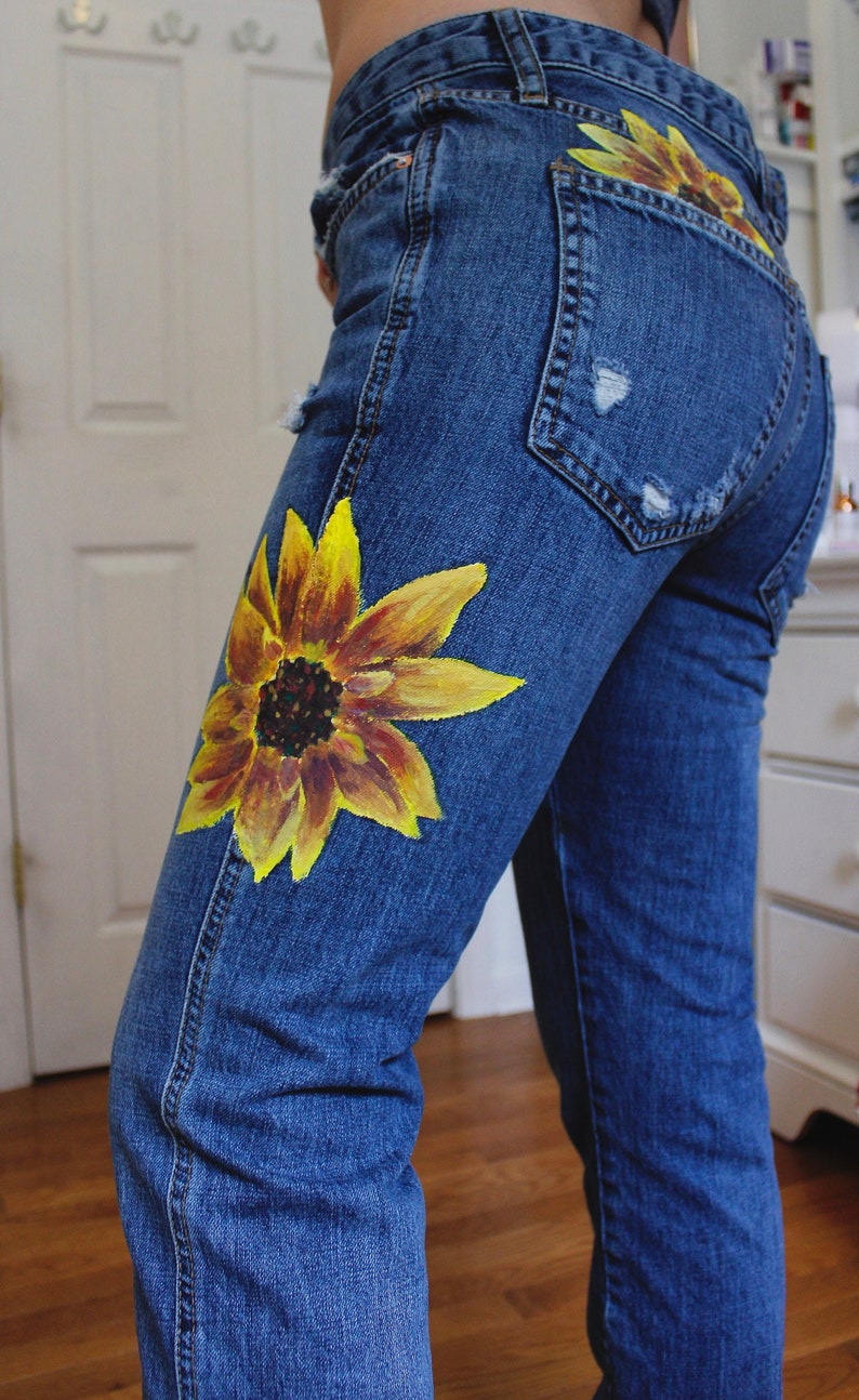 jeans with flowers painted on them