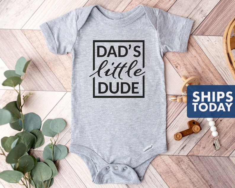 Dad's Little Dude Onesie® 100% Cotton or Cotton Blend Available in White or Gray Heather Gray