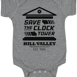 May include: A gray baby onesie with a black graphic of the clock tower from the movie Back to the Future. The graphic says "Save the Clock Tower" and "Hill Valley Preservation Society Est. 1985".