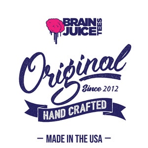 May include: A navy blue and white logo with the text "Brain Juice Tees" and a pink brain graphic. The text "Original Since 2012" is below the logo. A navy blue ribbon with the text "Hand Crafted" is below the text. The text "Made in the USA" is below the ribbon.