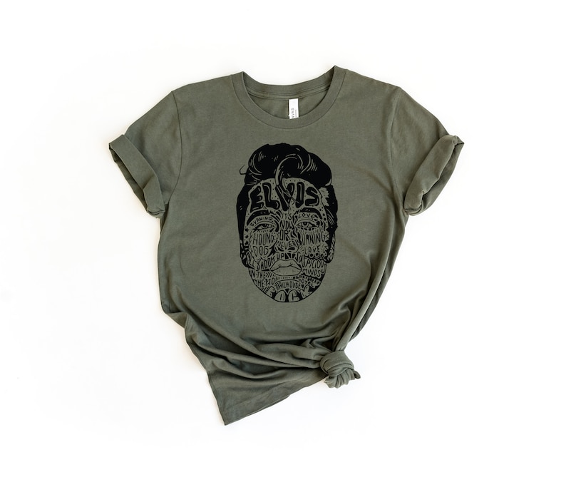 May include: A green t-shirt with a black graphic of Elvis Presley's face made up of words related to his music and career.