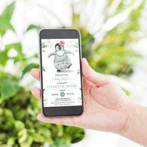 May include: A baby shower invitation featuring a cartoon penguin wearing a lei and a flower on its head. The text reads "Please join for a baby shower in honour of Stephanie Moore, March 23rd, from 3pm, The Moore Residence, 12 Main St, Alexandra 2015, RSVP to Handy by March 14 at 412 345 4578."