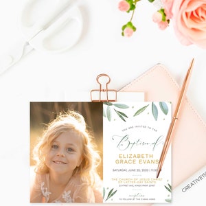 May include: A baptism invitation with a watercolor design of green leaves and gold accents. The invitation is for Elizabeth Grace Evans and includes the date, time, and location of the ceremony. The invitation also includes a photo of a young girl with blonde hair and blue eyes.