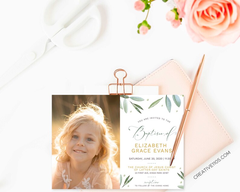 May include: A baptism invitation with a watercolor design of green leaves and gold accents. The invitation is for Elizabeth Grace Evans and includes the date, time, and location of the ceremony. The invitation also includes a photo of a young girl with blonde hair and blue eyes.