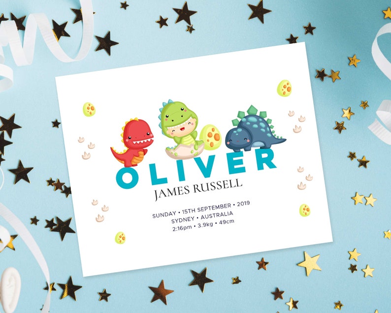 May include: A white card with a blue dinosaur theme announcing the birth of Oliver James Russell. The card includes the date and time of birth, weight, and length. The card features three cartoon dinosaurs, one red, one green, and one blue.