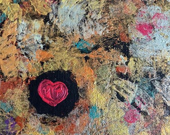 May include: Abstract painting with a textured surface. The artwork features a central black circle with a red heart. The background is a mix of gold, orange, yellow, and teal brushstrokes, creating a vibrant and colorful composition.