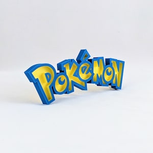 May include: A blue 3D plastic word that reads "Pokemon" with yellow letters. The letters are outlined in blue.