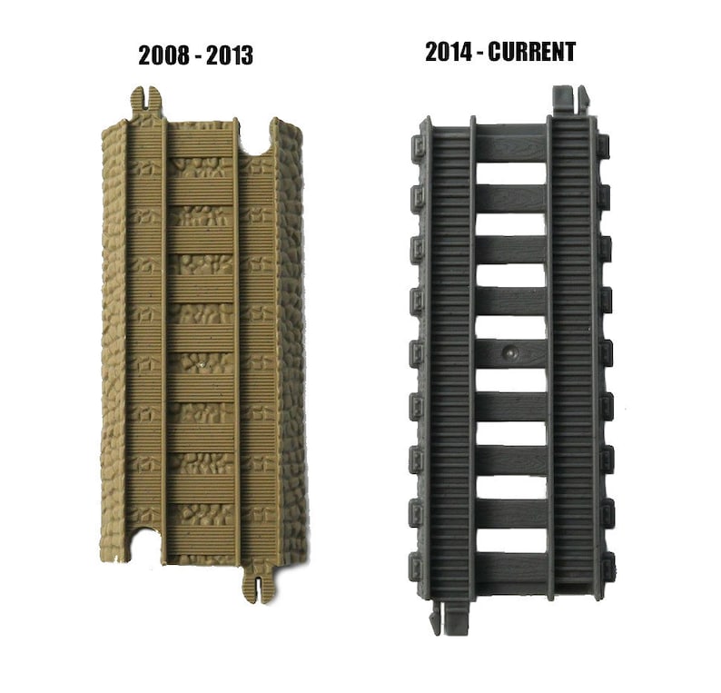 May include: Two pieces of plastic train track, one brown and one gray. The brown track is labeled "2008 - 2013" and the gray track is labeled "2014 - CURRENT".