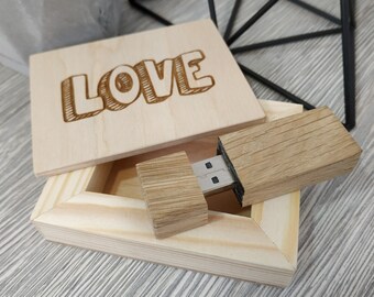 May include: A wooden box with the word "LOVE" engraved on the lid. The box is open and a wooden USB drive is inside.