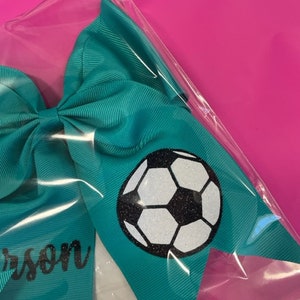 Flickors överdimensionerade fotbollsbåge bild 3