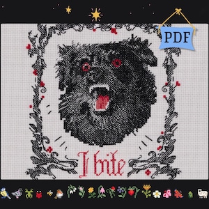 Puede incluir: Patrón de punto de cruz que presenta un perro negro gruñendo con ojos rojos y la boca abierta, enmarcado por un borde decorativo con el texto "I bite". El diseño está sobre un fondo blanco, con un icono PDF en la esquina superior derecha.