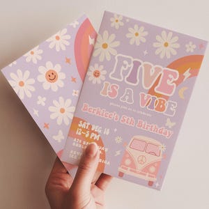 May include: Two lavender birthday invitations with a retro theme. One features the text "FIVE IS A VIBE" and a VW bus illustration. The other has a daisy and rainbow design. The invitations are held in a person's hand.
