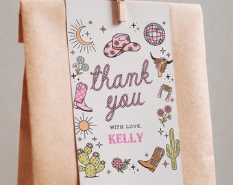 May include: A white thank you card with pink and black illustrations of cowboy boots, hats, cacti, and stars. The text on the card reads "Thank you" with "With love, Kelly" below.