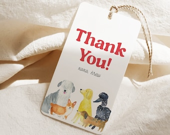 May include: A white rectangular gift tag with the words "Thank You!" in red, and "xoxo, Krew" in black. The tag features watercolor illustrations of several dog breeds, including a corgi and a poodle, with a twine string.