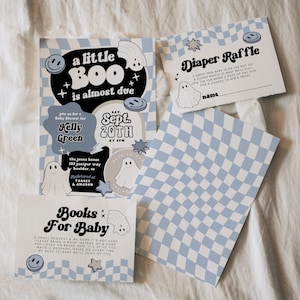 May include: A set of baby shower invitations and cards with a light blue and white checkered pattern. The invitations feature the text "a little BOO is almost due" and include details for the event.