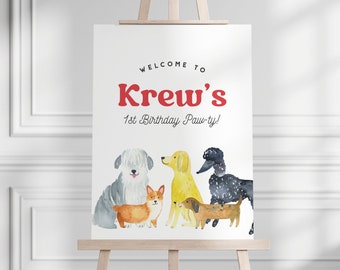 May include: Welcome to Krew's 1st Birthday Paw-ty! A white sign with red text and a watercolor illustration of five dogs. The dogs are a corgi, a golden retriever, a poodle, a dachshund, and a sheepdog.