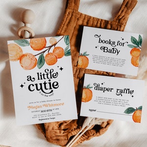 May include: A baby shower invitation with orange and green illustrations of oranges and leaves. The invitation reads "a little cutie is on the way?" and includes the name Megan Whitmore, the date and time of the shower, and the RSVP information. There are also two cards for a book and diaper raffle.