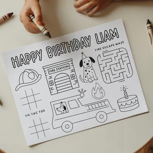 May include: A black and white birthday activity sheet with the text "HAPPY BIRTHDAY LIAM". The sheet includes a fire station, a Dalmatian dog, a fire escape maze, a fire truck, a birthday cake, and a tic-tac-toe game.