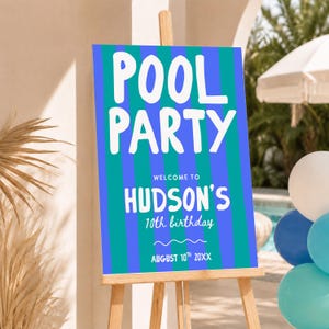 May include: A rectangular sign on a wooden easel featuring vertical teal and blue stripes. The text reads POOL PARTY, WELCOME TO HUDSON'S 10th birthday, and AUGUST 10th 20XX in white lettering. The sign has a wavy line graphic below the birthday text.
