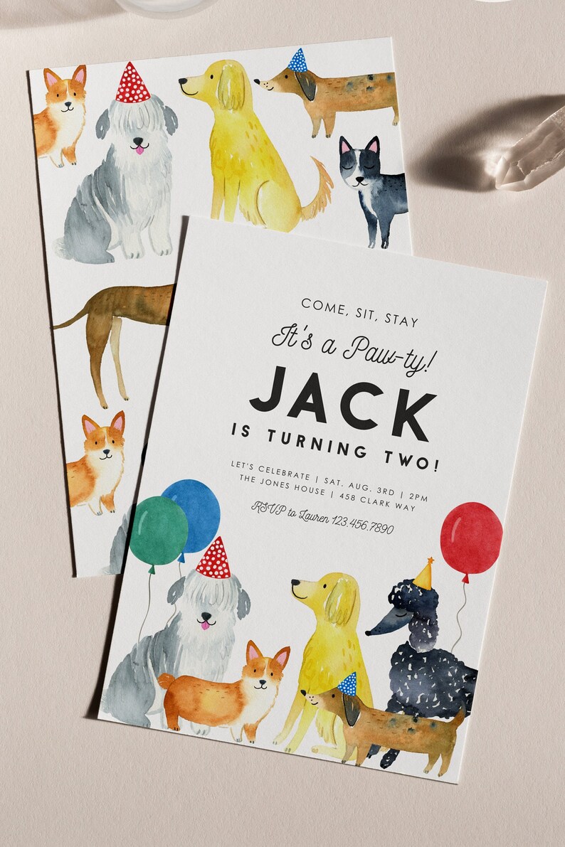 May include: A birthday party invitation with a watercolor illustration of dogs wearing party hats. The invitation says "Come, Sit, Stay It's a Paw-ty! Jack is turning two! Let's celebrate Sat. Aug. 3rd 2PM The Jones House 458 Clark Way RSVP to Lauren 123.456.7890"