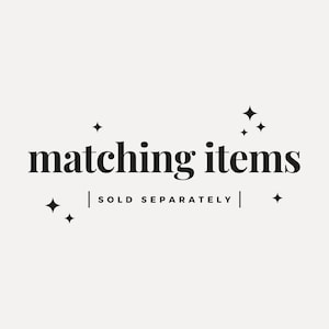 May include: Matching items graphic with the text "matching items" and "sold separately" in black text on a white background with small star accents.