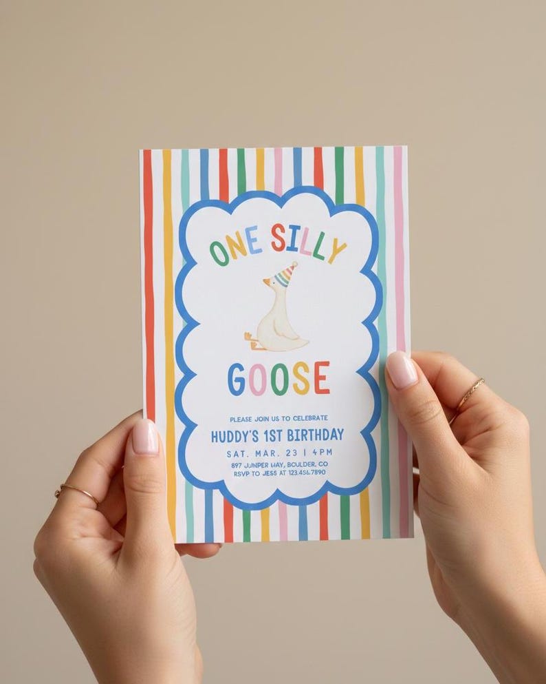 May include: A colorful birthday invitation with the text "ONE SILLY GOOSE" and "HUDDY'S 1ST BIRTHDAY." The design features a cartoon goose wearing a party hat, set against a background of vertical rainbow stripes.